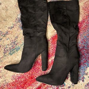 Slouchy black heeled boots